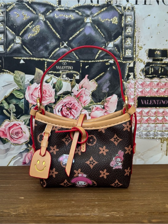 Handbags - Brown Patterned Bucket Mini Bag with Tan accents.